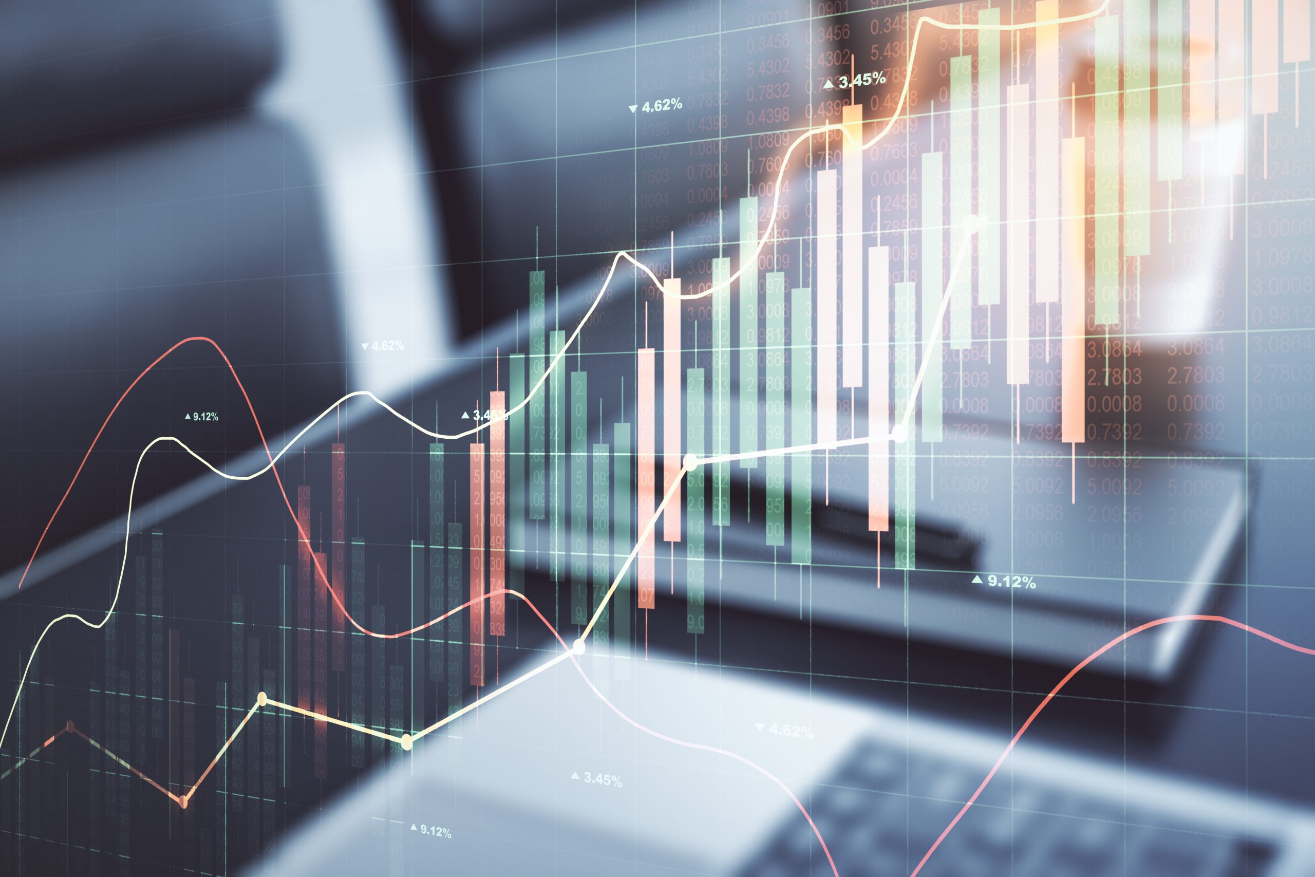 Multi exposure of abstract financial graph on laptop background, financial and trading concept Multi exposure of abstract financial graph on laptop background, financial and trading concept